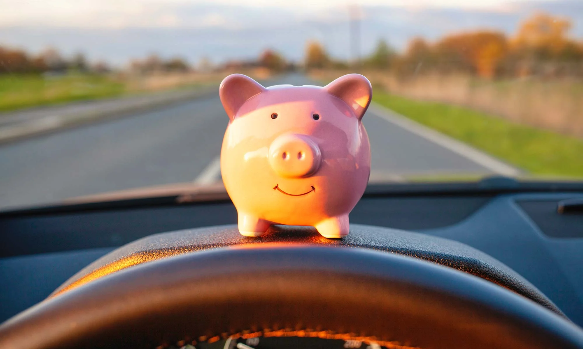 Piggy Bank on Car Dashboard