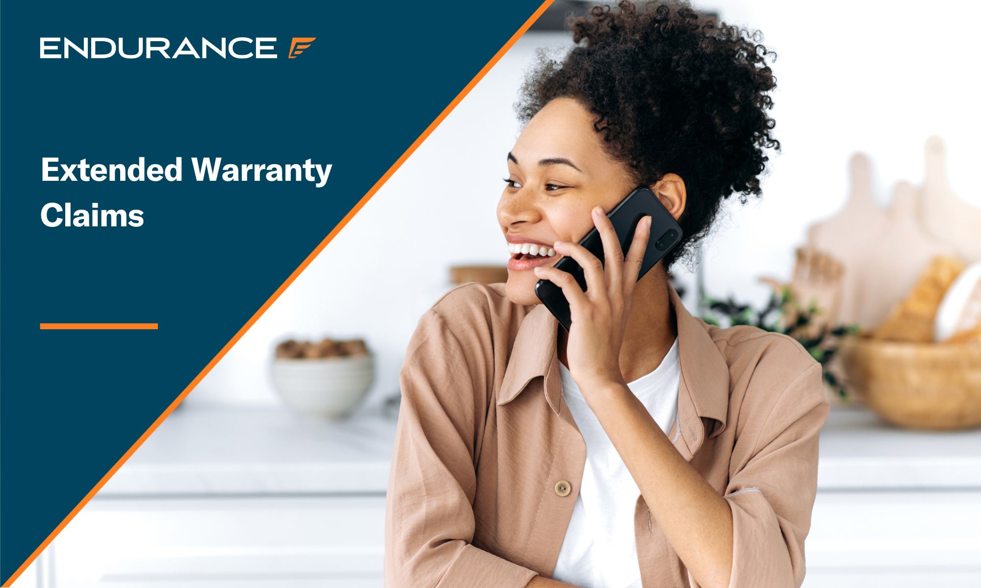 Woman sitting in her kitchen talking on the phone with her warranty company