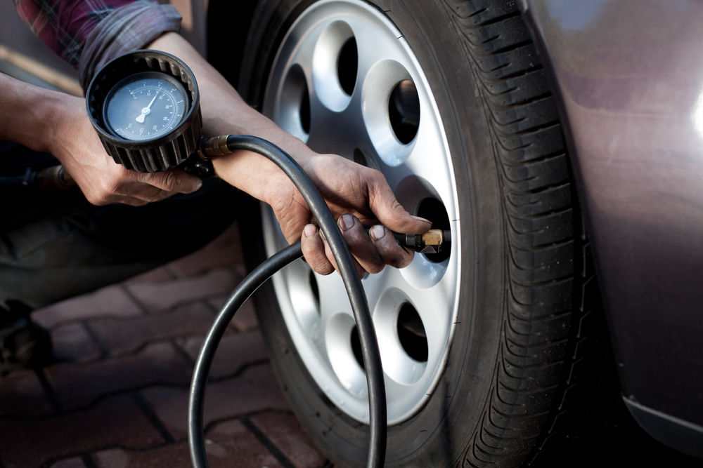 checking-tire-pressure-before-road-trip