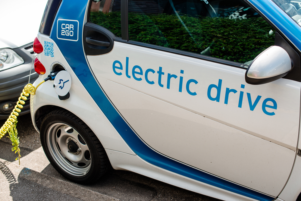 An electric Smart of car sharing company car2go is being plugged into a charging station in Stuttgart, Germany.