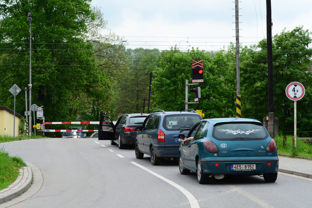 Cars crossing railroad tracks. speed bump