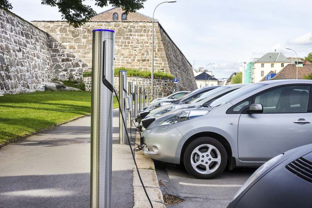 Electric car plugged in to electricity