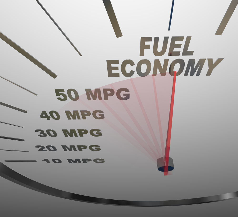 The words Fuel Economy on a vehicle speedometer with a red needle racing past numbers 10, 20, 30, 40, 50 MPG as the automobile achieves an improved efficiency rating as mandated by the government