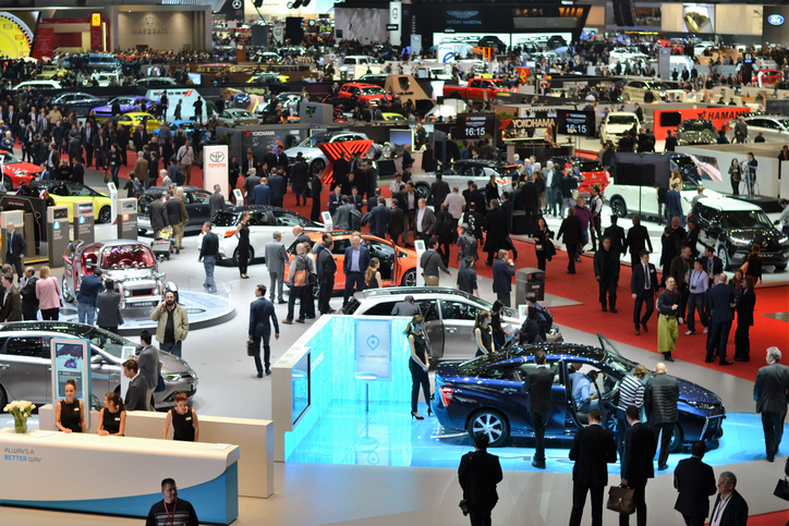 Switzerland, Geneva - March 16, 2017: The visitors (especially journalists and businessmens) looking on the new cars on the motor show. In a few days above 700 000 visitors from 110 countries saw the 900 vehicles from 220 brands on the Geneva Motor Show.