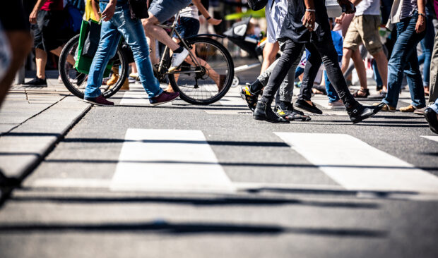 An image of pedestrians crossing a cross walk.