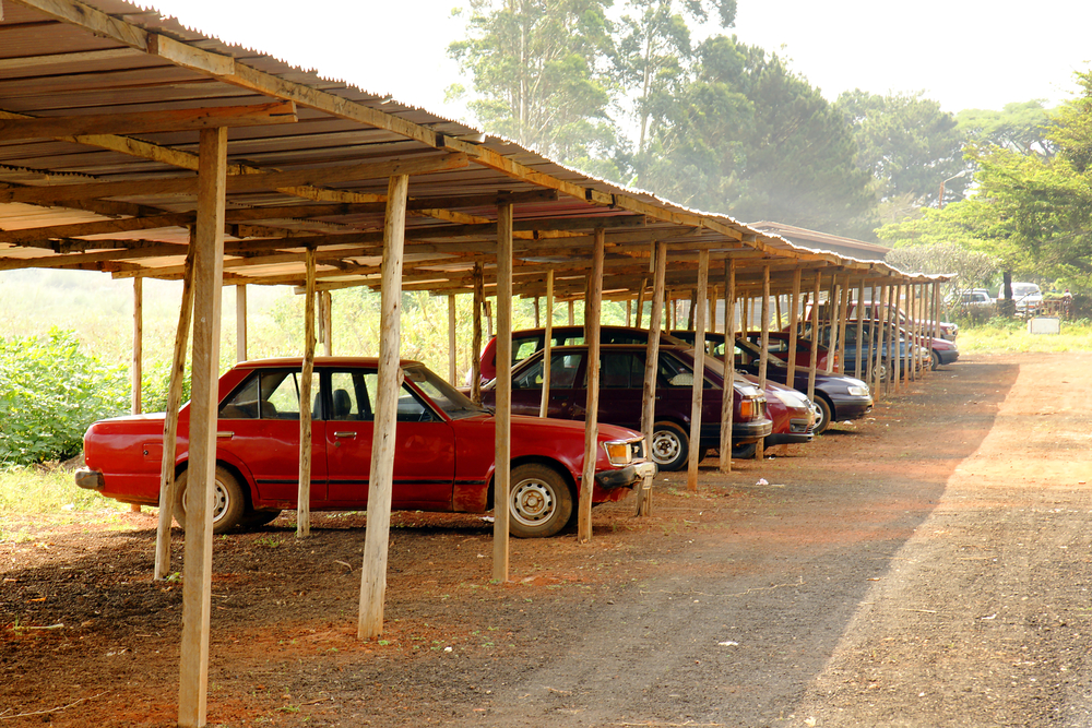 Cars parked under the shade of a carport