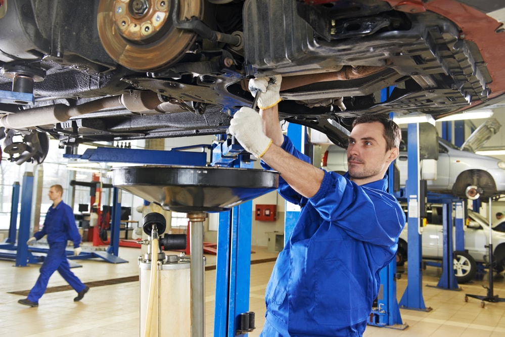 auto worker assembling suspension