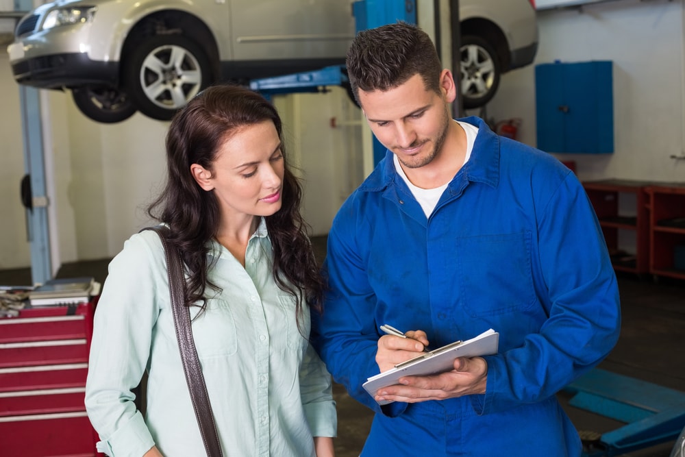 mechanic and customer reviewing