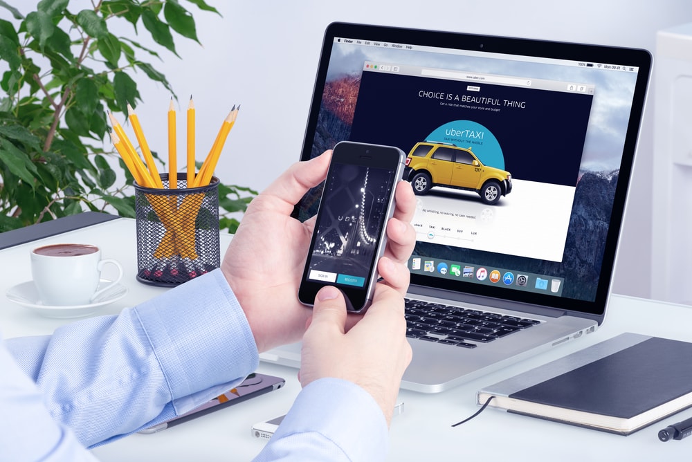 uber app on phone and computer