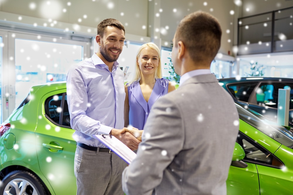 couple buying electric car