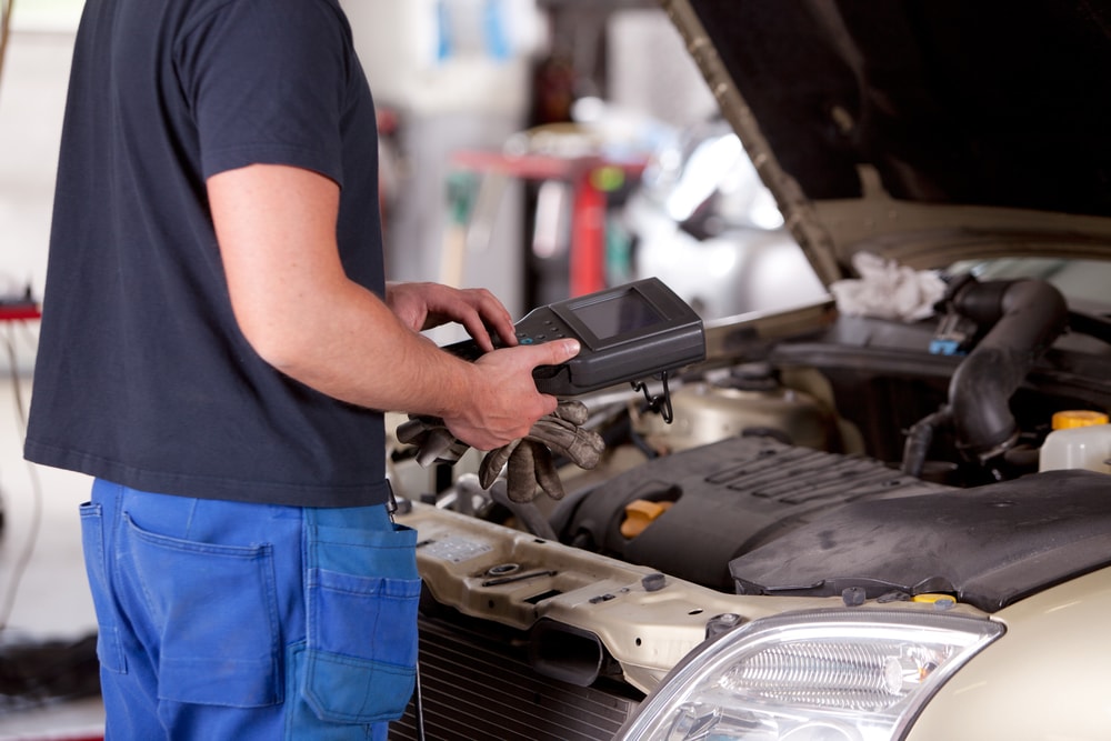 mechanic checking a car