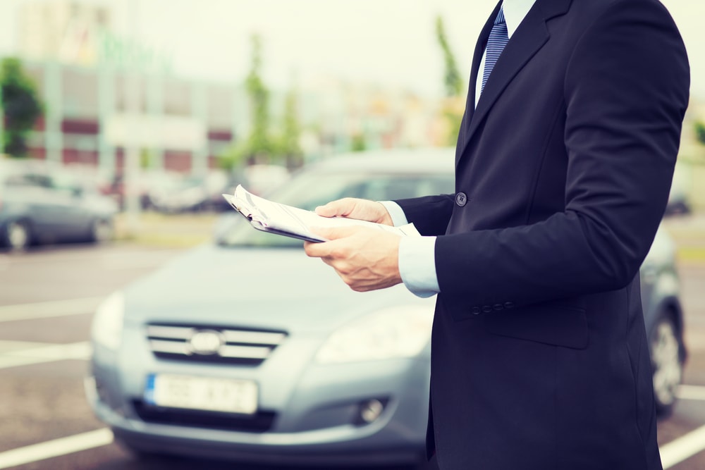 dealer with car documents