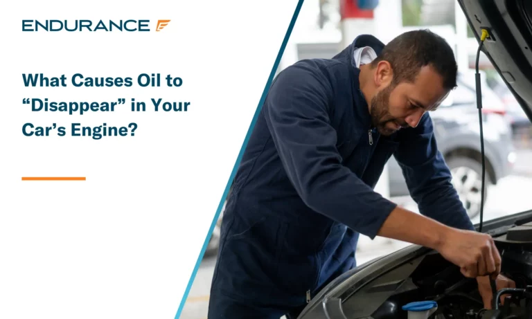 Mechanic changing the oil in a car