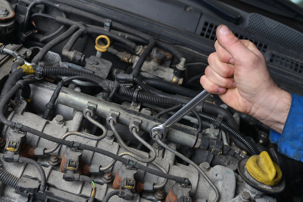 mechanic working on engine