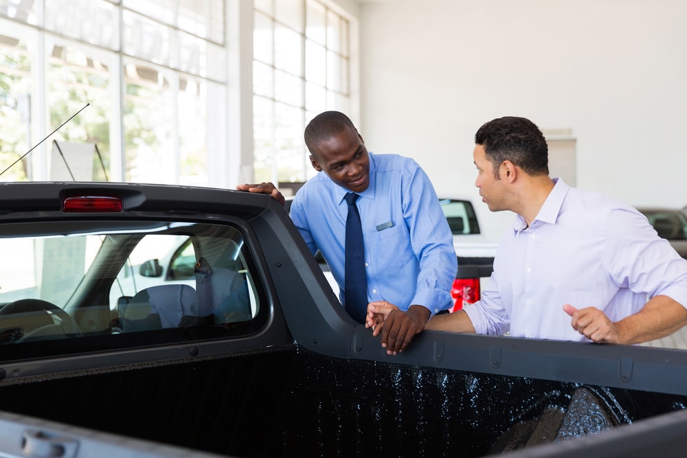 man buying trucks