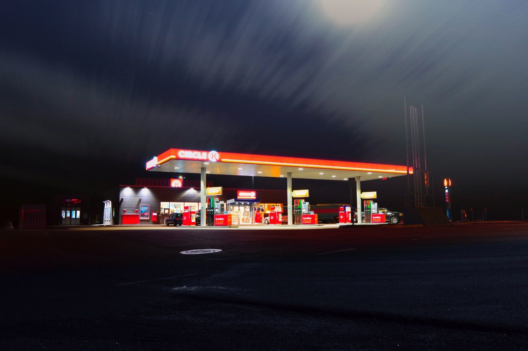 A gas station at night.