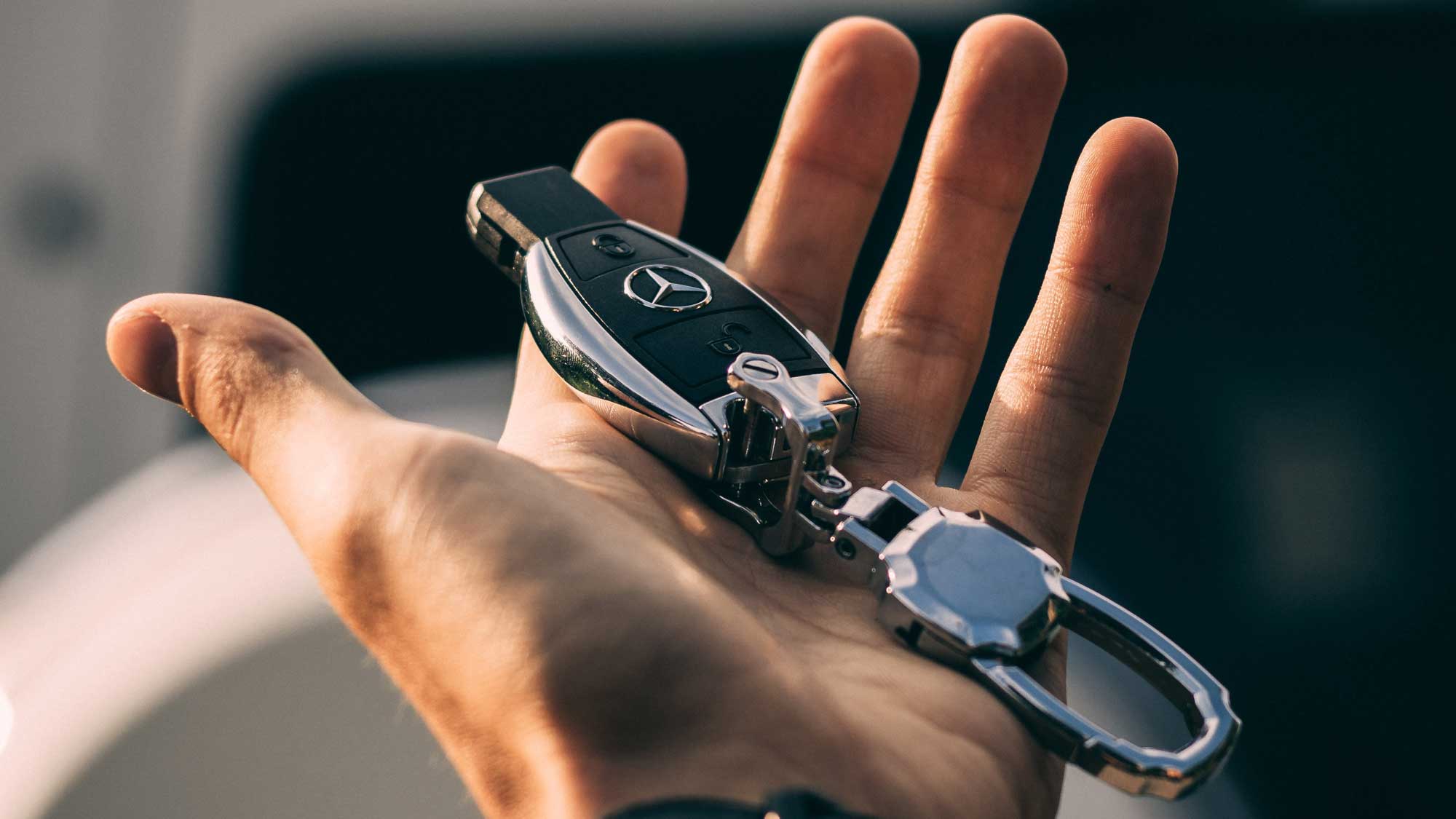 car key fob in hand