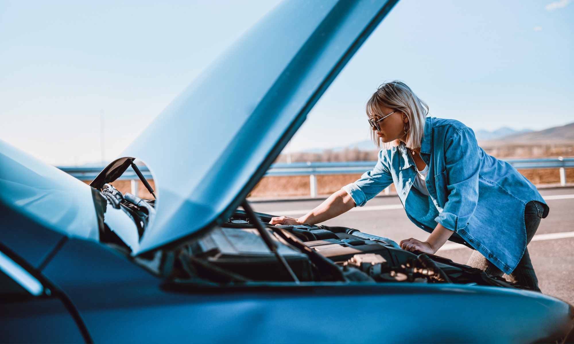 Woman Checking Car Water Pressure After Stalling In Road