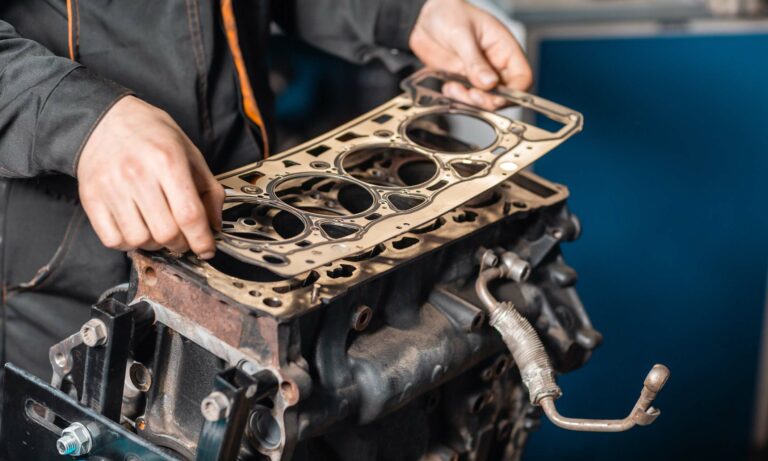 A mechanic fixing a head gasket.