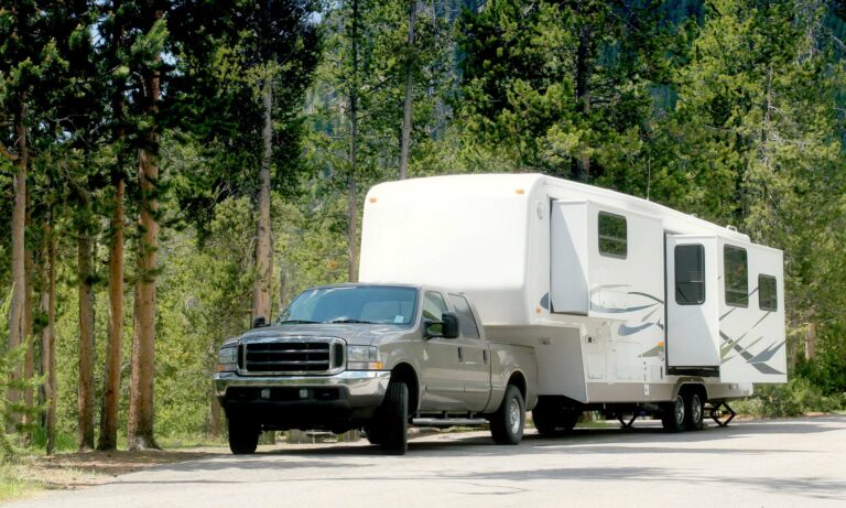 A pickup towing a camper.