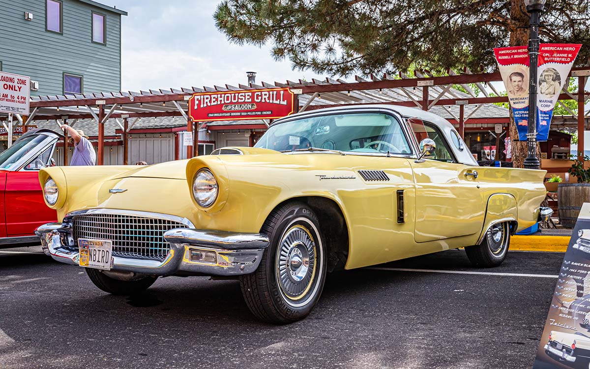 A yellow 1957 Ford Thunderbird.