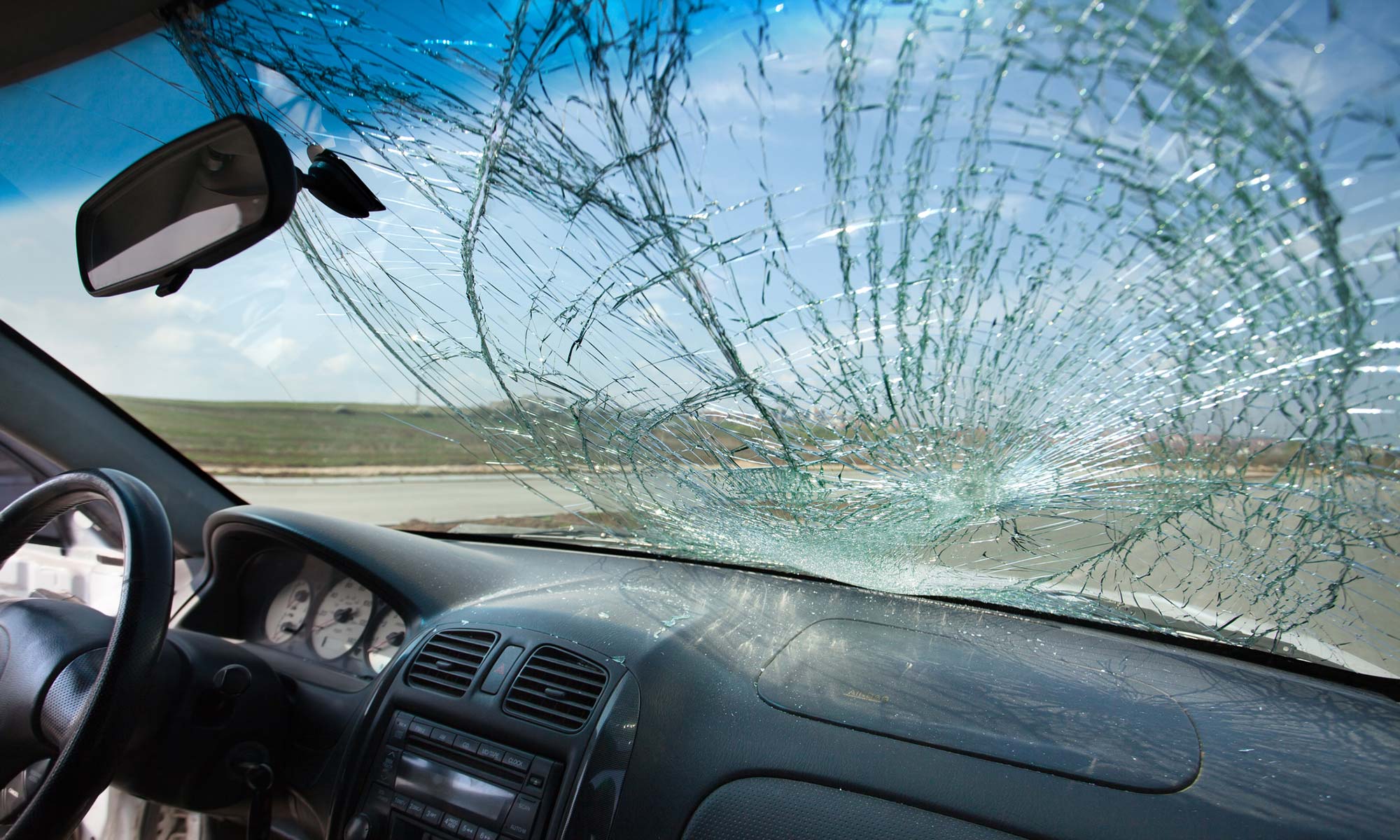 A severely damaged car windshield.