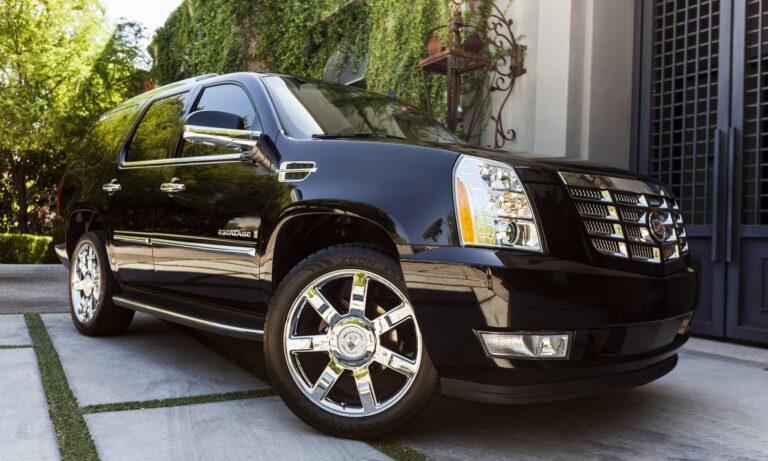 A photo of a black parked Cadillac Escalade