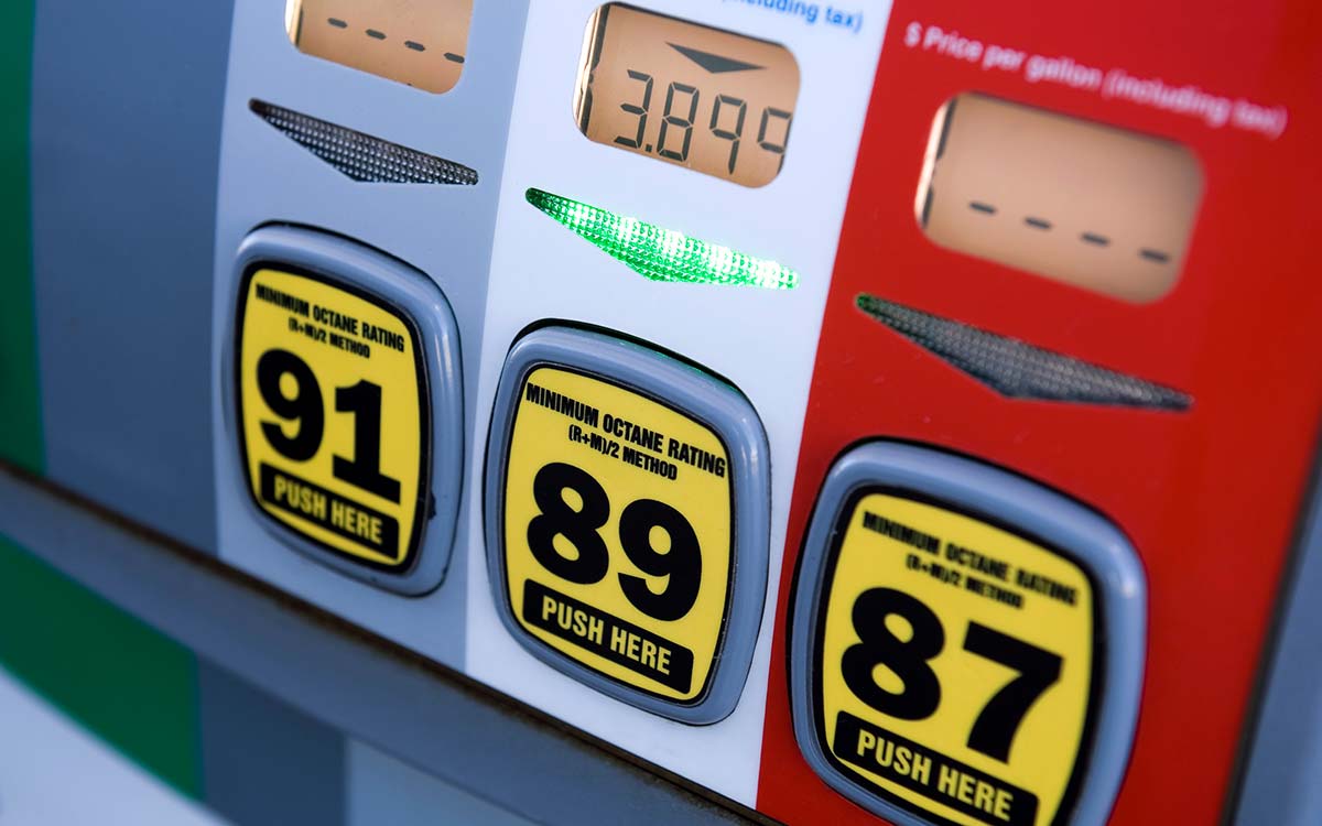 A close up of a gas pump showing three different octane ratings of fuel: 91, 89, and 87.