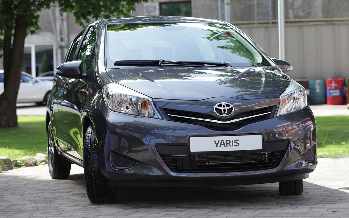 A Toyota Yaris parked outside.