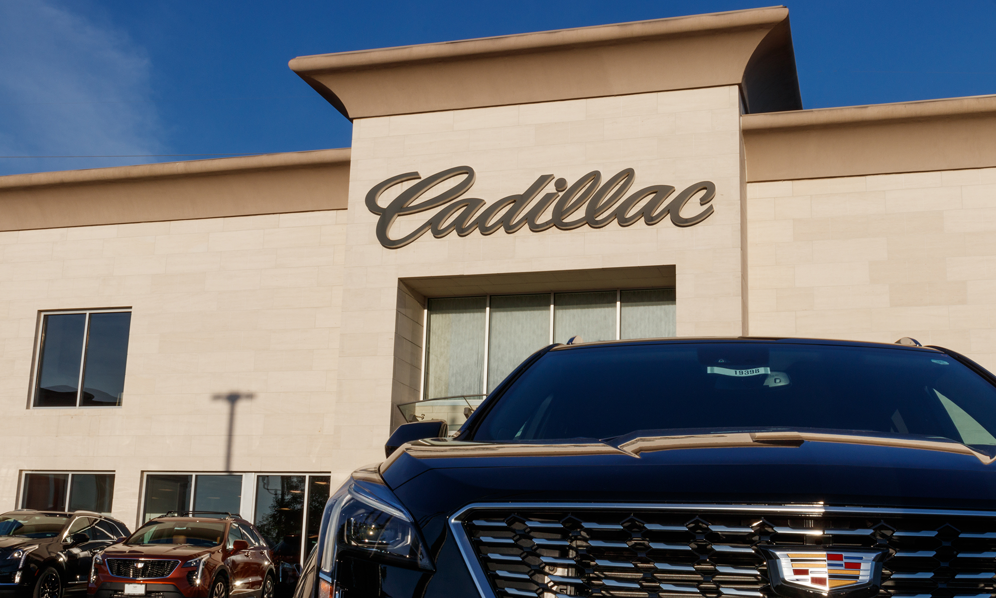 The outside of a Cadillac dealership.