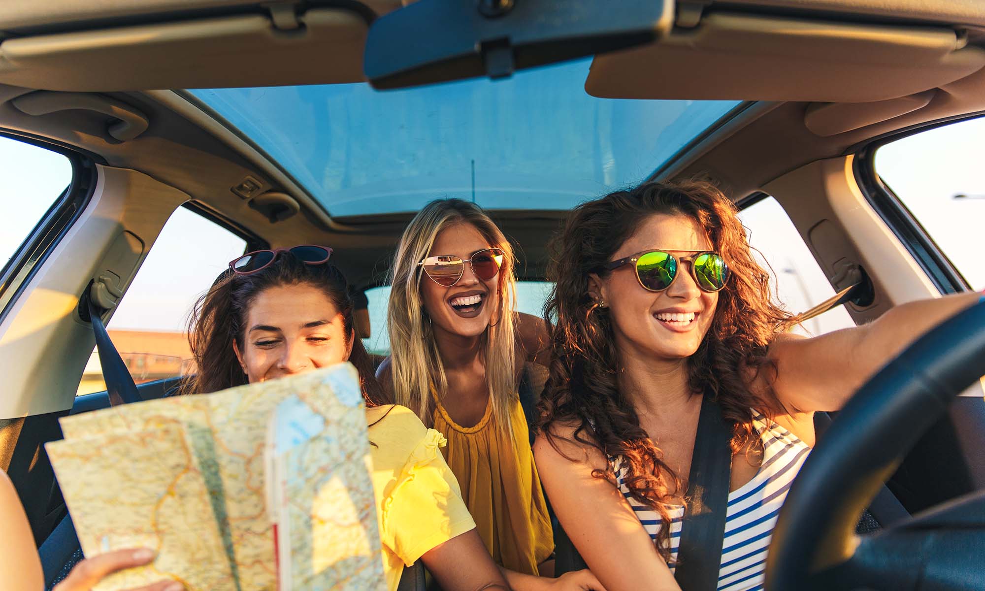 A group of three friends on a road trip together.