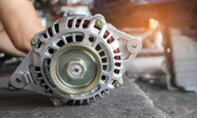 A close up image of a car's alternator.
