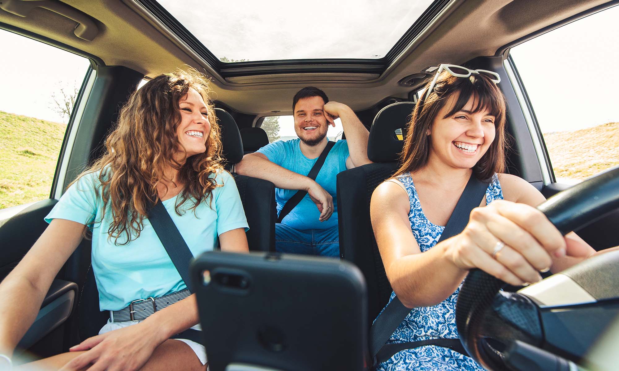A group of friends on a road trip use their smartphone, and apps like the Endurance Mobile app, to help them have a safe and fun trip.