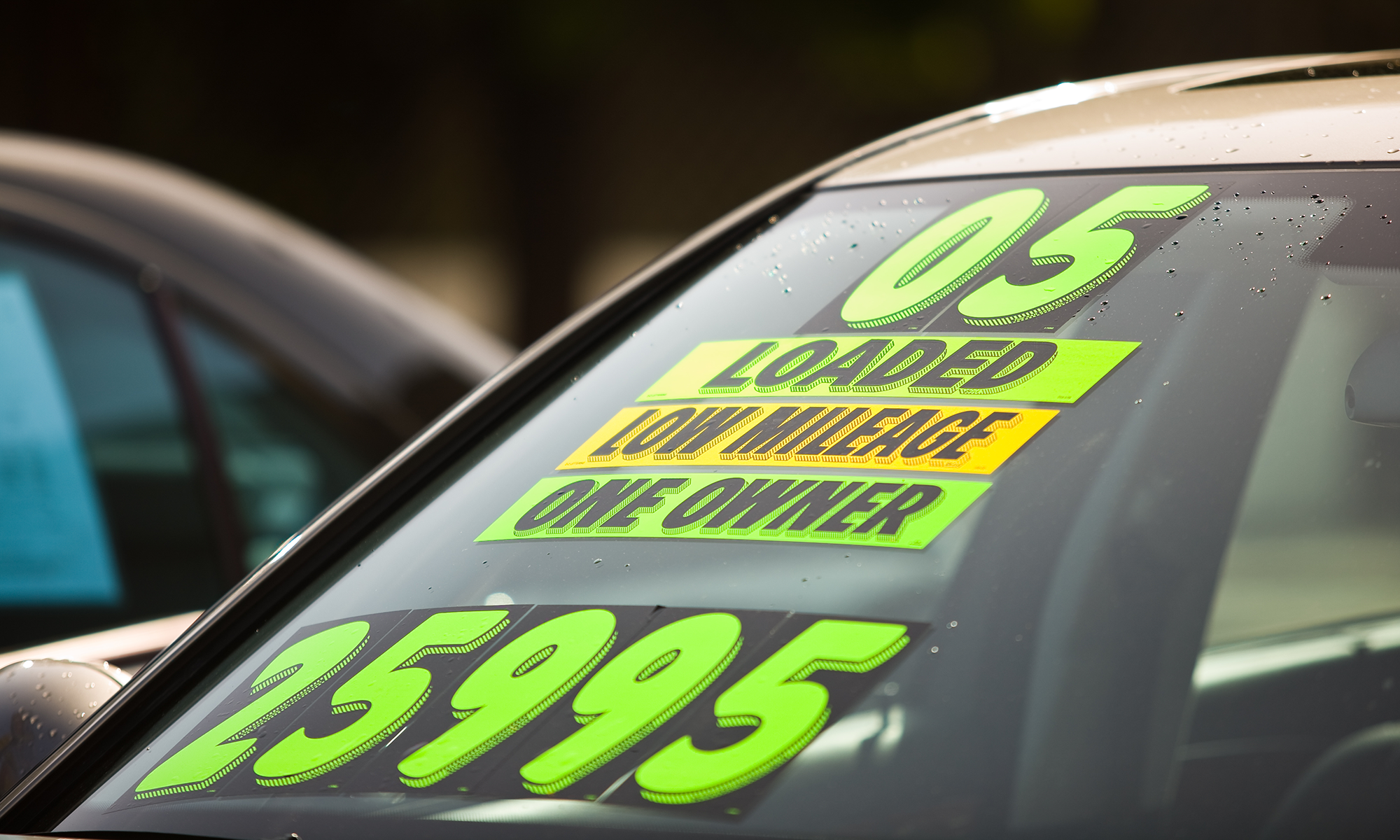 Stickers on the windshield of a used car stating that it is an '05 model year,