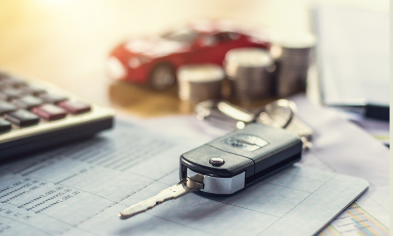 A pair of car keys sit on a table next to a calculator and a bill for various car repairs, which you can get covered with an Endurance Warranty vehicle protection plan.