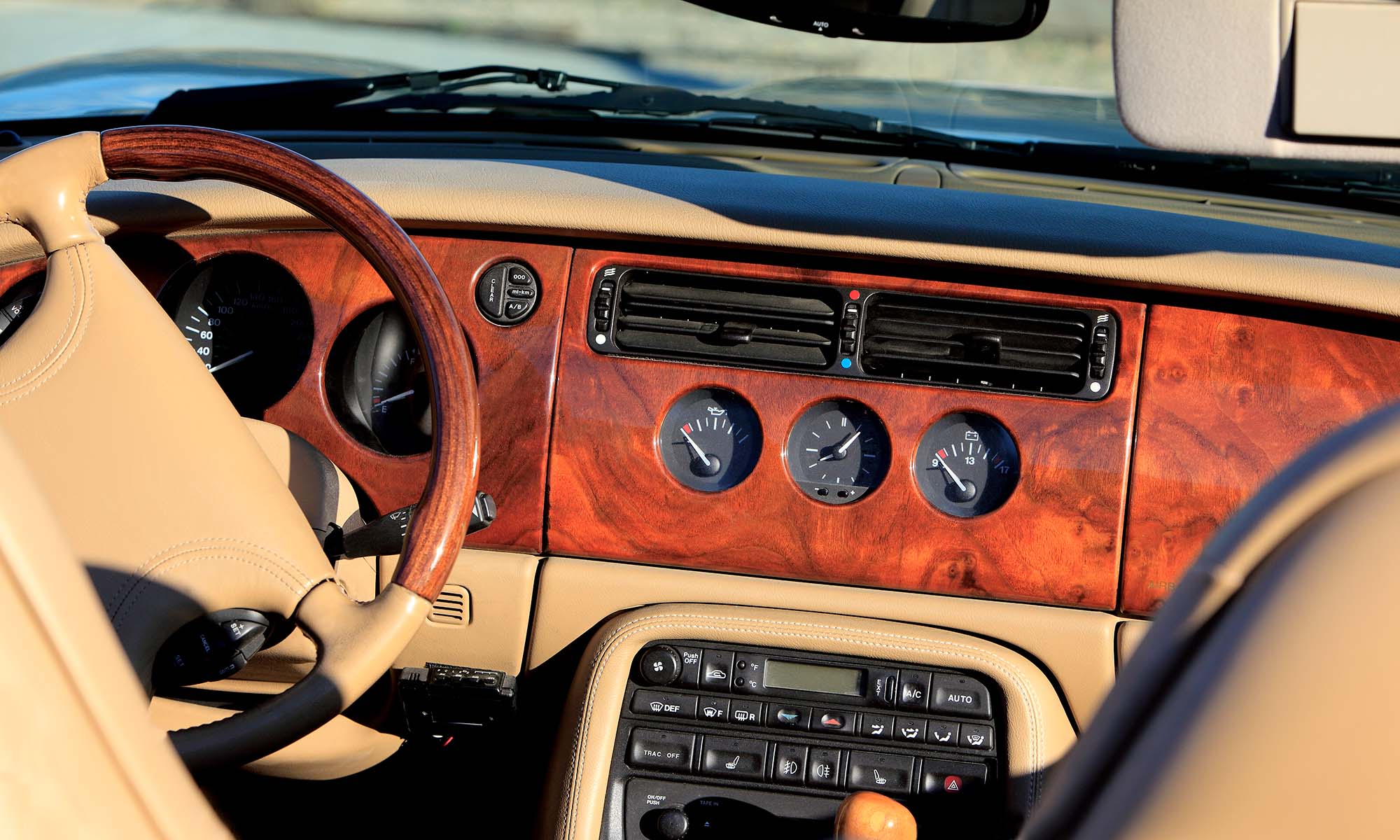 A close up of the interior of a car from the 1990s.