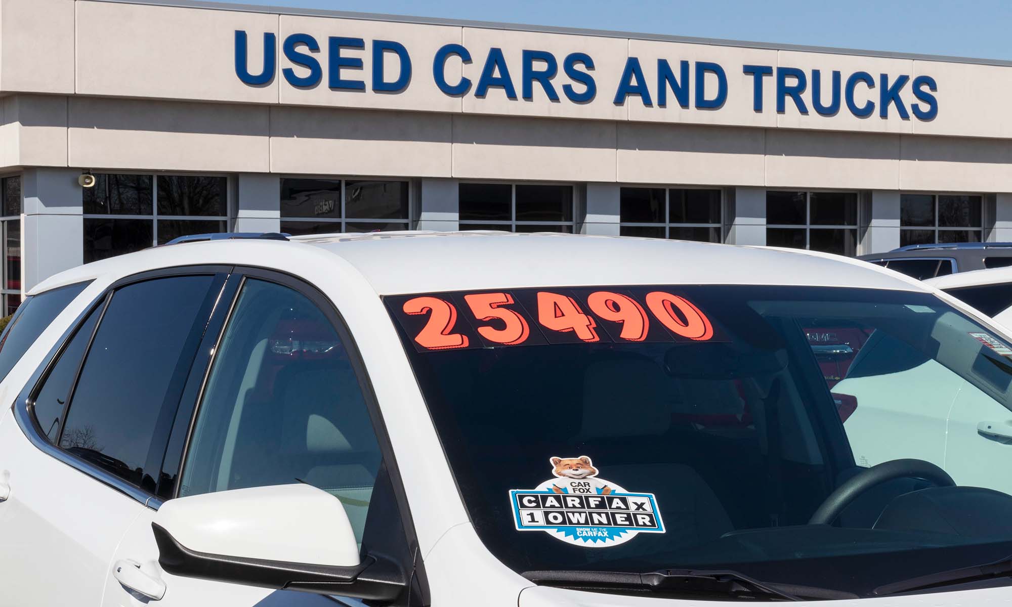 A used car, which can get covered with an Endurance auto protection plan, sits outside a used car and truck dealership.