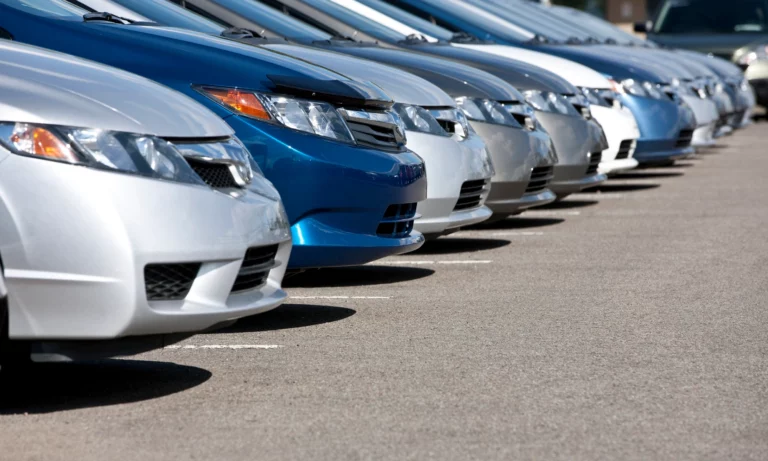 Line of new cars at a dealership