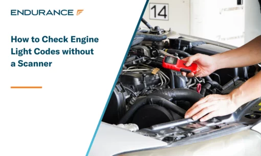 Mechanic is using a diagnostic car code reader for a check engine light