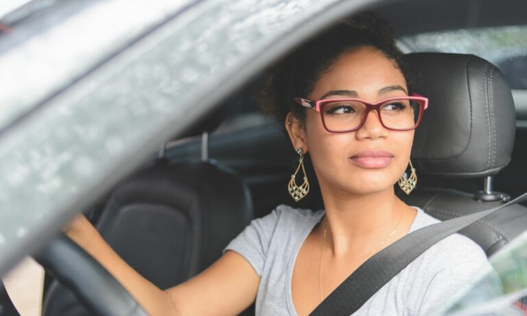 Young woman driving a car