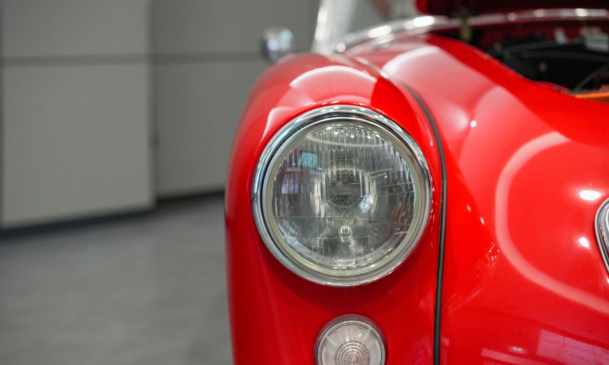 A closeup of red retro Volkswagen beetle car