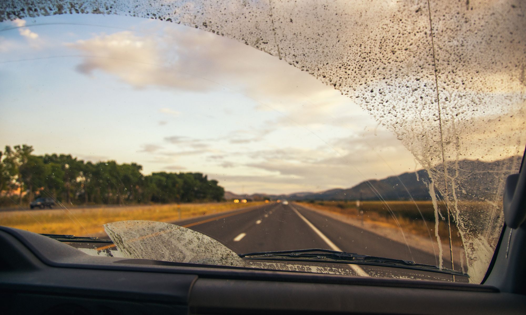 Driving on a road with a dirty windshield