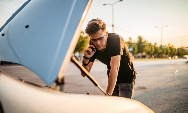 Young man had a car breakdown and calling roadside assistance for his Honda