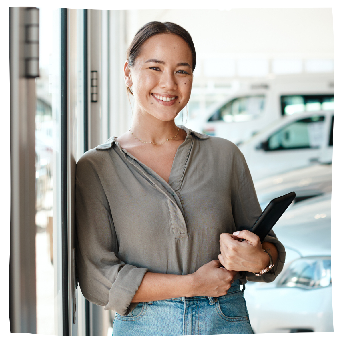 Woman car salesman holding a tablet