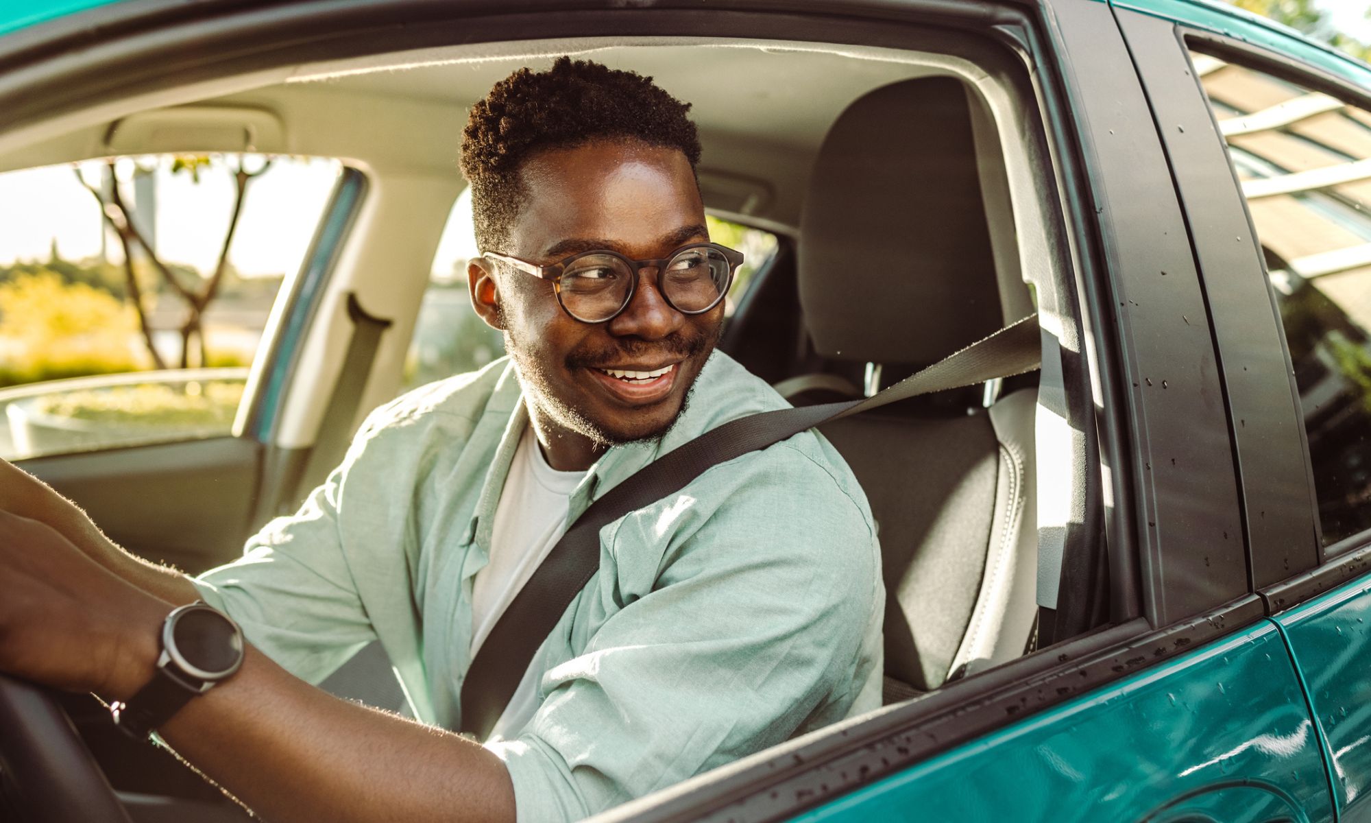 Man smiling while driving a Honda Accord