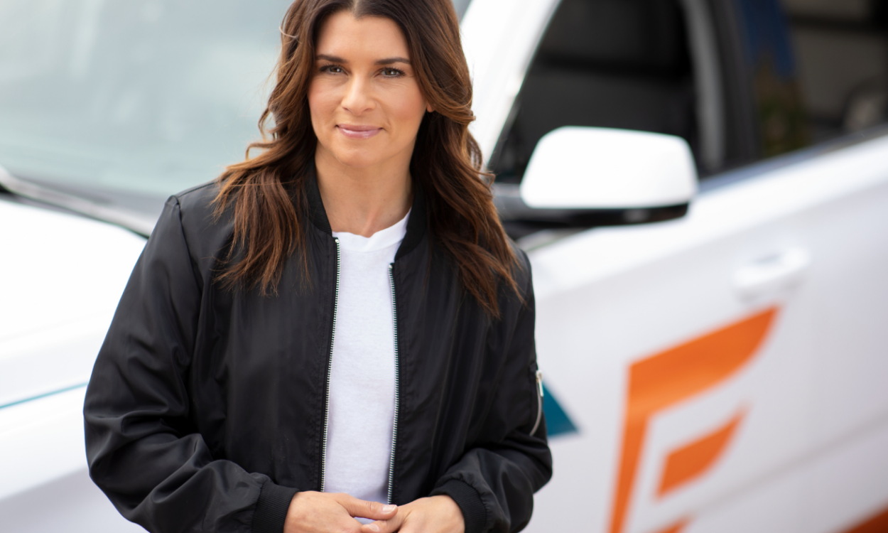 Danica Patrick Leaning On Car With Endurance Logo