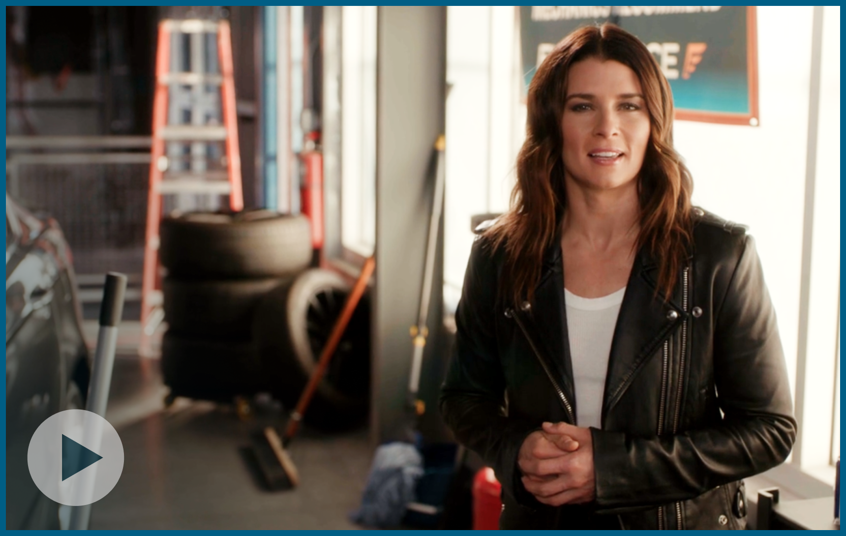 Danica Patrick Standing In A Garage