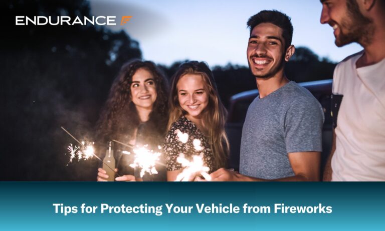 A group of young friends with sparklers standing outdoors on a roadtrip