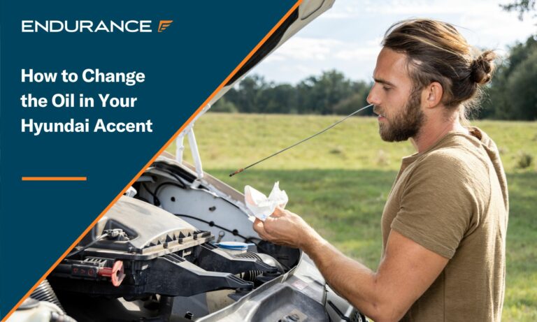 Man checking the oil level of his car outdoors