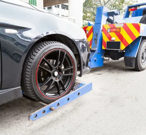 Dark Gray Car Being Towed